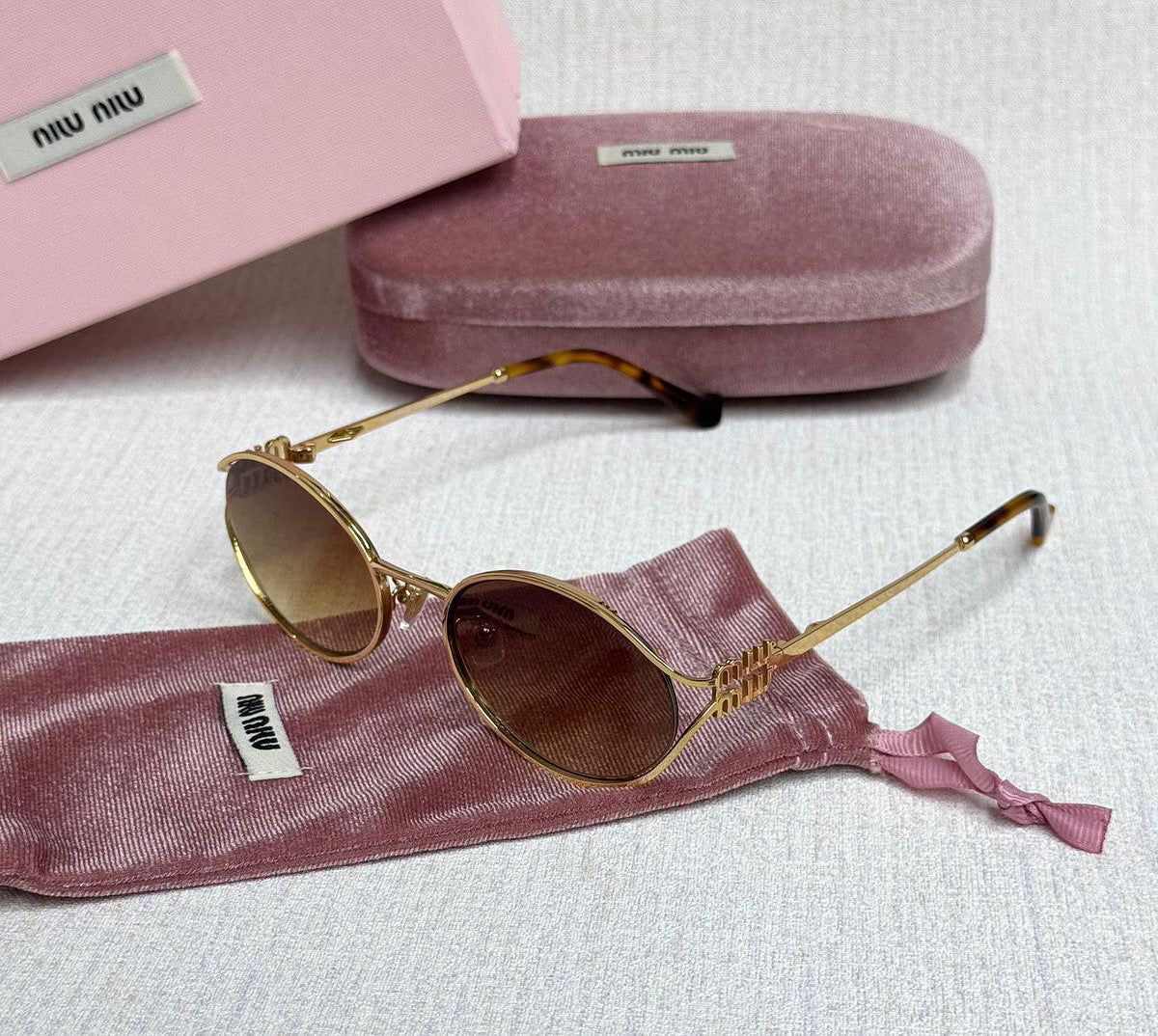 MIUMIU OVAL sunglasses